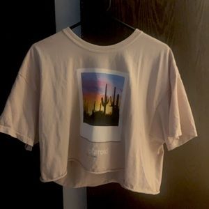 This is a cream, Polaroid shirt with an image of a sunset in the desert. 🏜 NEW